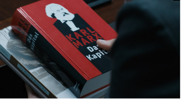 Liz looking at books by Marx and Orwell.