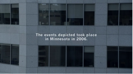 A closer shot of the office building. Text reads: