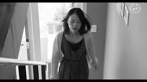 Still from Hong Sang-soo's "Grass" shows a person ascending the stairs.